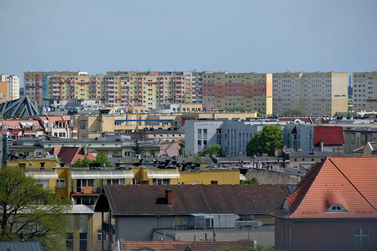 A vibrant cityscape featuring colorful apartment buildings and rooftops.