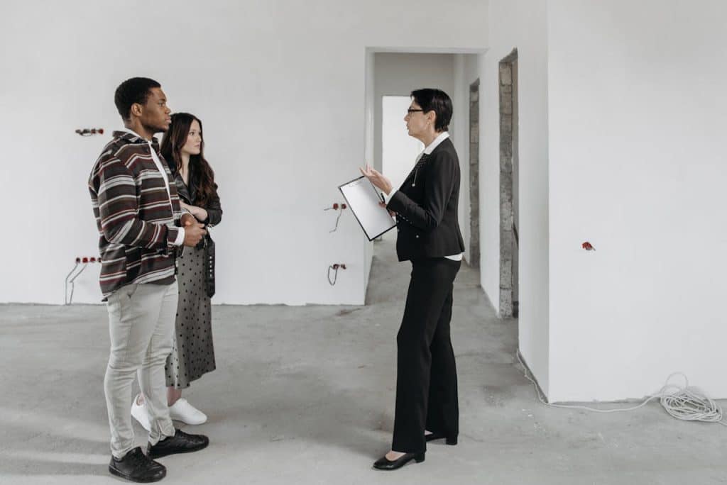 A client consultation during a renovation project in an empty room.
