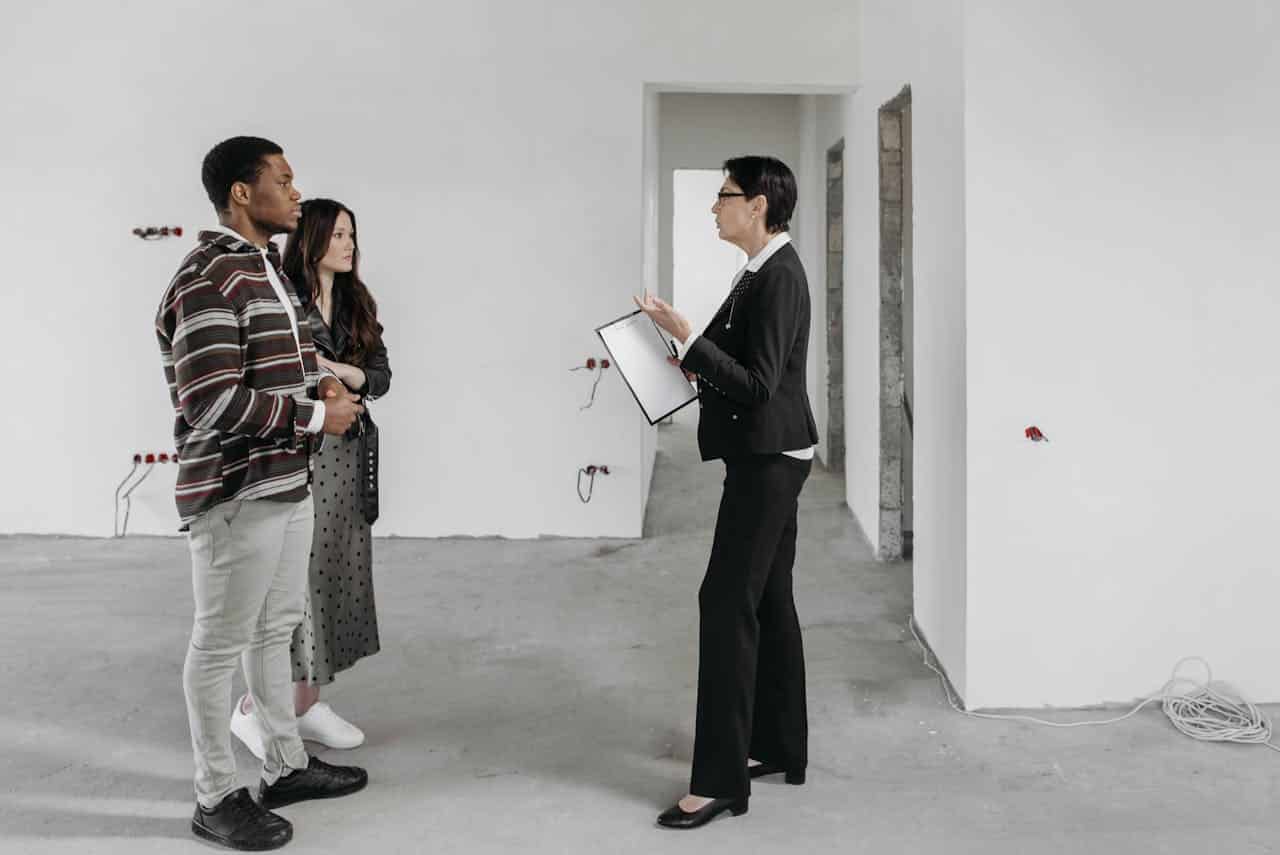 A client consultation during a renovation project in an empty room.