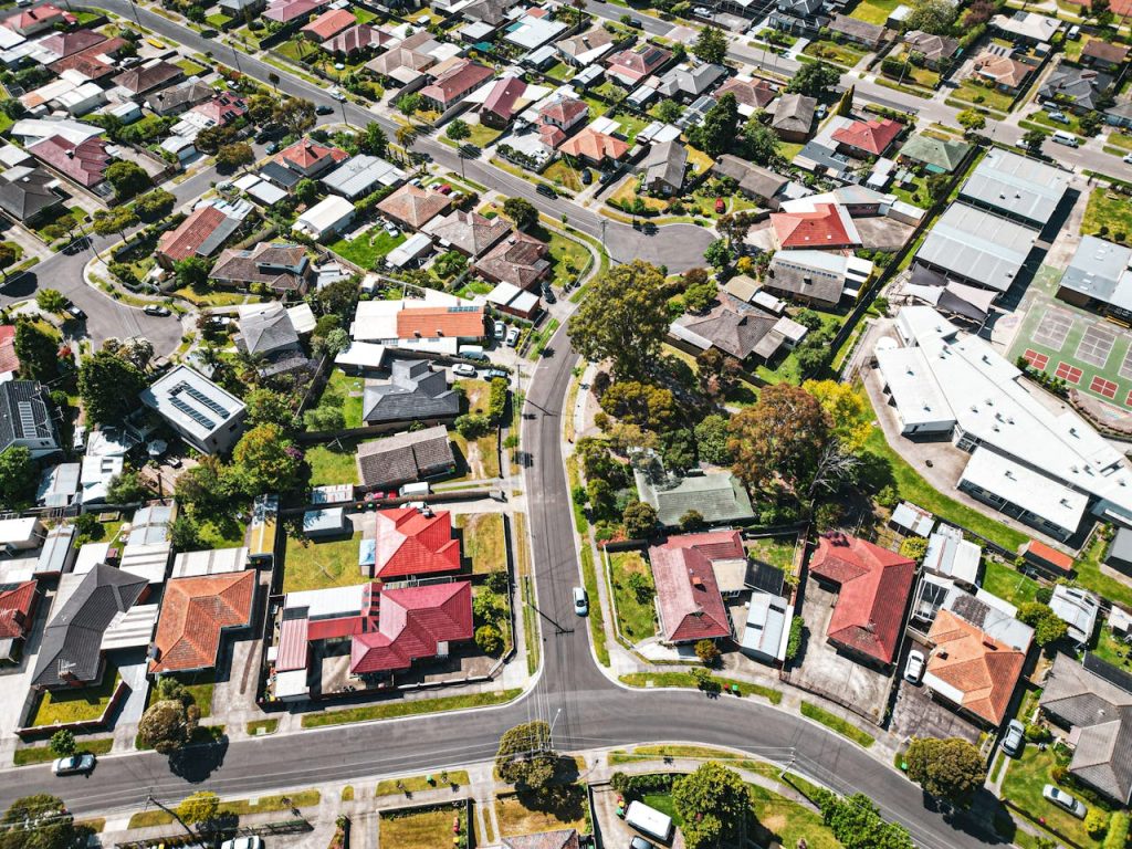Aerial view of a suburban neighborhood with houses and roads.
