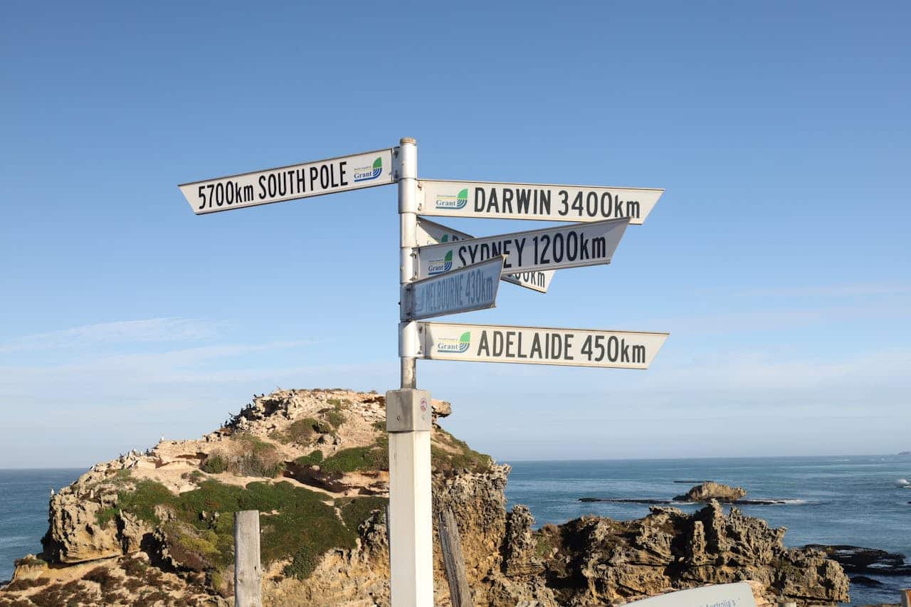 Direction signs indicating distances to various Australian cities and the South Pole.