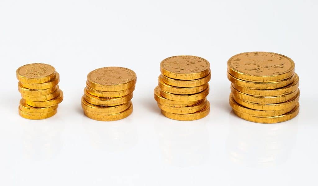 Stacked gold coins showcasing varying sizes.