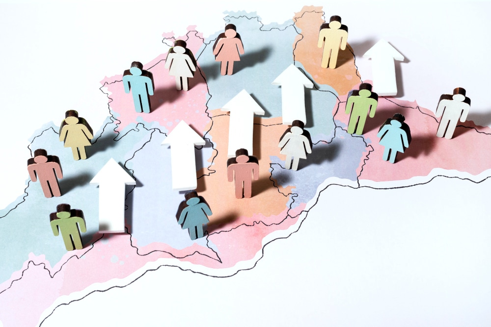 An illustration of a map showing growth trends with colorful people icons and arrows.